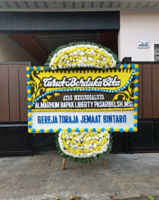 Papan Bunga Duka di Obi